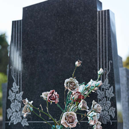 An eternal expression of love and remembrance. Shot of a gravestone in a cemetery.の写真素材