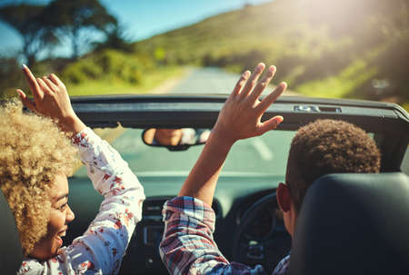 Nothing better than a road trip with your favorite person. Cropped shot of a happy young couple out...