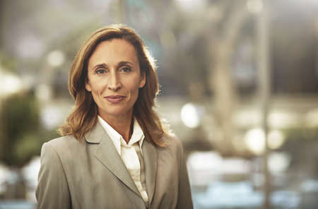 Time ti get back to business. Cropped portrait of a businesswoman standing outside.の写真素材
