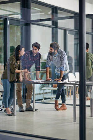 I think we should run with our ideas so far. Shot of a group of young creatives having a discussion...