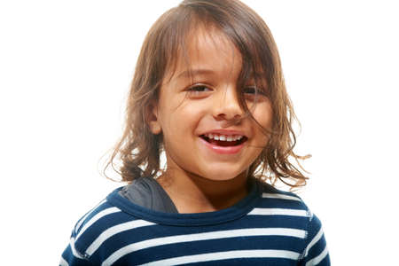 Happy and cute. Closeup portrait of a happy young boy.