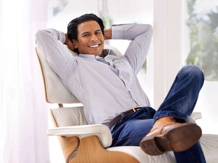 Hes ready for the work day. A handsome young businessman in his home.の写真素材