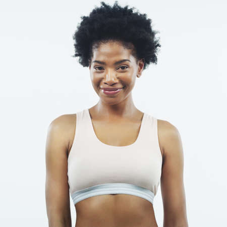 I look and feel amazing. Studio shot of an attractive young female athlete posing against a grey...
