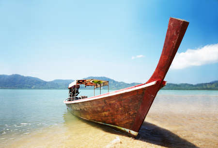 Traditional Thai boat. Traditional Thai long tail boat on the beach - Thailand.の写真素材