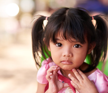 The face of innocence. Portrait of a little girl spending time outdoors.の写真素材