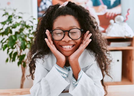 Why didnt anyone tell me science is so much fun. Portrait of an adorable young school girl feeling...