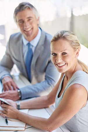 Theyre a powerful corporate combo. Portrait of two mature businesspeople talking together of a...