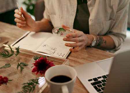 I need to restock on this beauty. Cropped shot of an unrecognizable florist writing on her notepad...