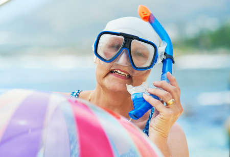My inner child never passes up on a snorkelling opportunity. Shot of a mature woman wearing snorkel...