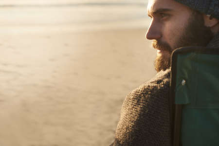 Taking a break. SIde view of an attractive man looking into the distance.の写真素材