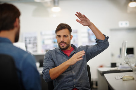 We should be thinking much bigger now. Shot of a young businessman gesturing while explaining...