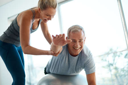 Your goals are within reach. Cropped shot of an attractive mature woman helping her husband with his...