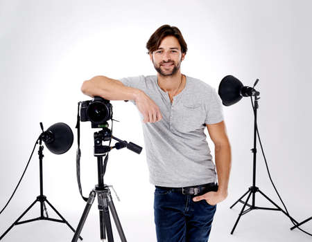 Tools of the photography trade. A professional photographer with his equipment.の写真素材