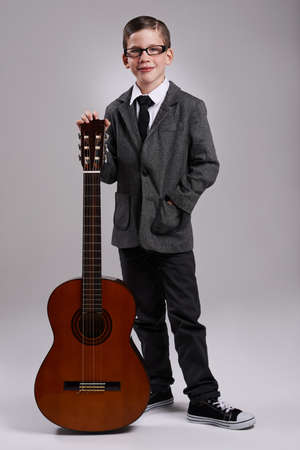 Hes a virtuoso. Studio shot of a young musician dressed in a suit.