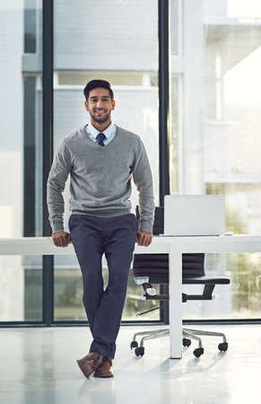 My door is always open. Full length portrait of a young businessman standing in his office.