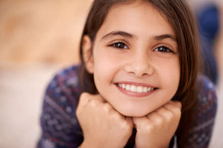 Boredom Whats that. Portrait of a cute little girl enjoying a day at home.の写真素材