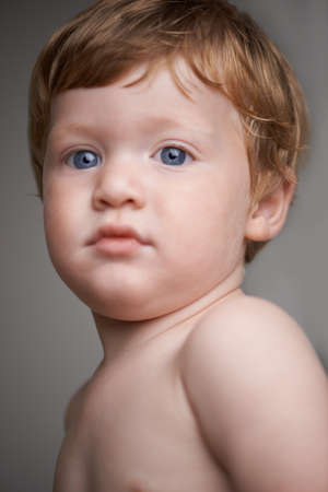 Childhood innocence. Cropped head and shoulders portrait of a cute little toddler.