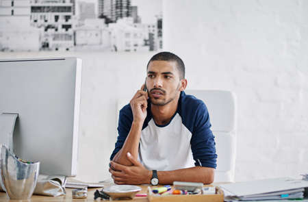 Technology makes it all easier. Cropped shot of a handsome businessman in his office.