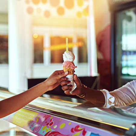 Theres always time for ice cream. Shot of a young woman enjoying an ice cream.
