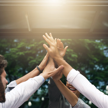 Were the ones who know how to make it happen. Shot of a group of businesspeople high fiving...
