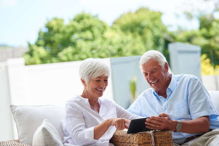 See, it works with touch. Shot of a senior couple using a tablet while sitting on their patio9.