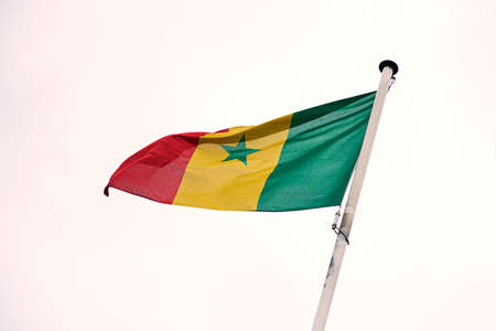 The flag of Senegal. Shot of the Senegalese flag blowing in the wind.の写真素材
