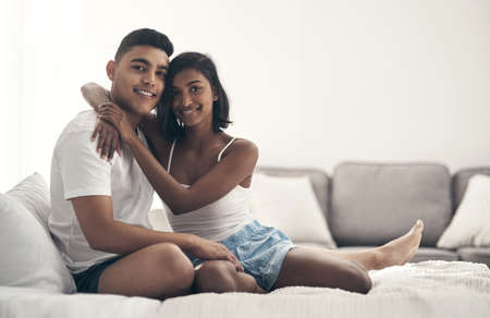 We love spending time together. Shot of a young couple sharing an intimate moment at home.