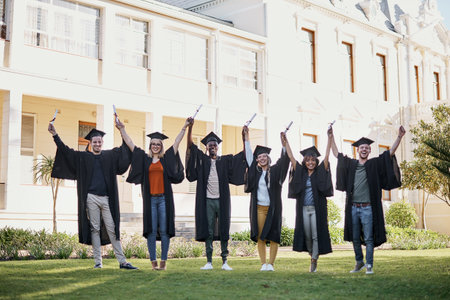 Its our ticket to success. Portrait of a group of students standing in a line with their arms raised...