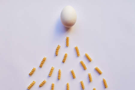 Last one there is a rotten egg. Studio shot of an egg against a grey background while being...