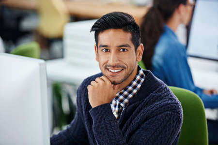 Coming up with a fool-proof plan. Cropped shot of a handsome young designer working on a pc.
