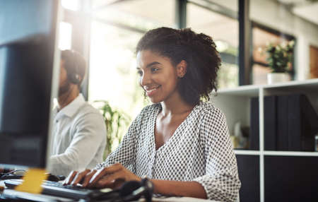Shes personally invested in the company. Shot of a young businesswoman working on her computer with...