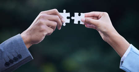 Combining two brilliant business ideas. Cropped shot of two unrecognisable businesspeople standing...