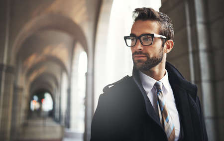 His style says a lot about him. Shot of a stylish young businessman in the city.