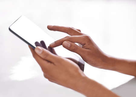Technology is a touch away. Cropped shot of a person using a digital tablet.