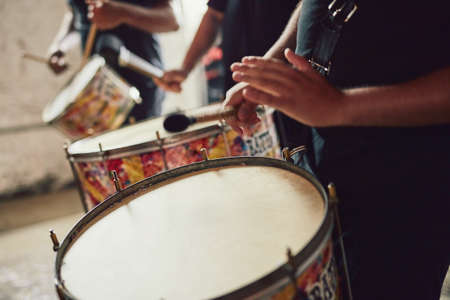 Sounds that come straight out of Brazil. Closeup shot of a musical performer playing drums with his...