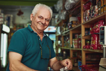 Its never too late to do what you really want. Shot of a senior man working in a store.