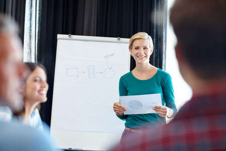 Show them some employee appreciation. Shot of an attractive woman doing a presentation for her...