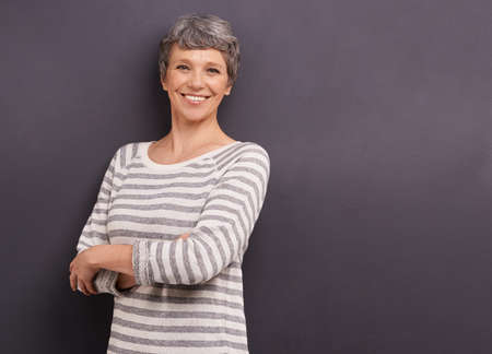 Ive made the most of my life. Studio portrait of a confident elderly woman against a gray...