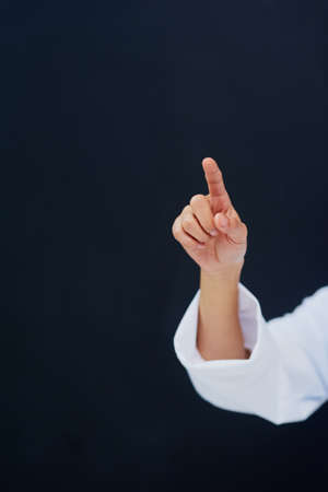 One touch is all it takes. Cropped shot of an unrecognizable female nurses hand while using a...