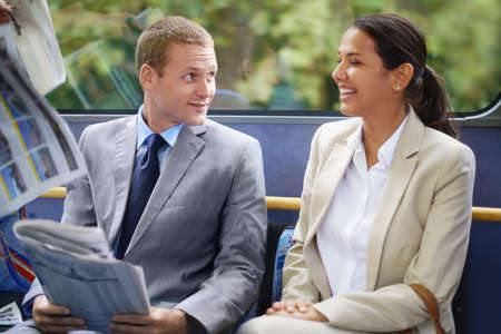 The daily commute. Shot of young business people commuting to work.