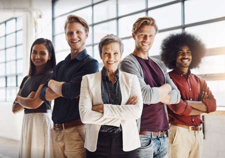 The team you can always depend on. Portrait of a team of happy designers posing confidently in their...