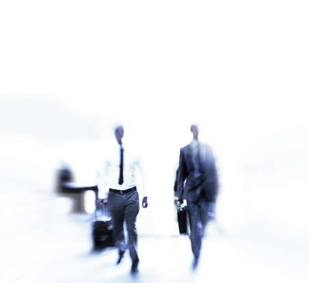 Rushing through the daily grind. Blurred shot of a businesspeople commuting.の写真素材