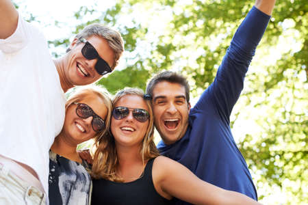Outdoor festivities. Four friends partying and celebrating at a music festival.