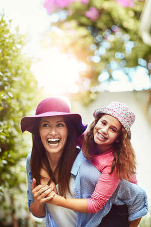 Out making memories. A happy mother and daughter spending time together outdoors.の写真素材