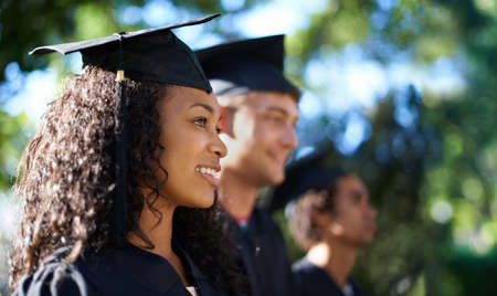Were ready to take on the real world. Shot of a diverse group of students on graduation day.の写真素材
