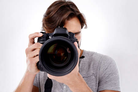 Say cheese. Closeup of a photographer about to take your picture.