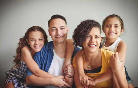Its the little things in life that matters most. Portrait of a happy young family spending quality time together.の写真素材