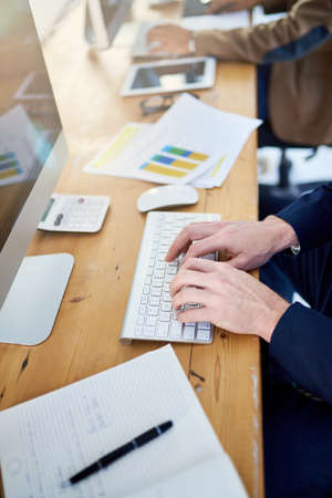Working towards a successful business. Shot of corporate people working in a modern office.の写真素材