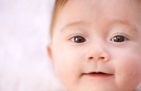 Filled with wonder at her world. Shot of an adorable baby girl with red hair.