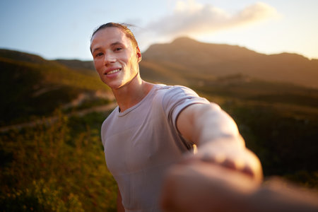 Well done weve gotten this far. Shot of a young man taking a break during his workout.の写真素材